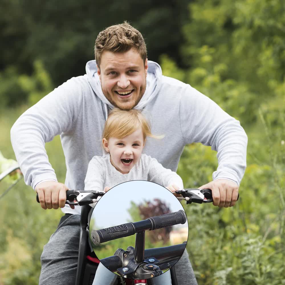 Father and smiling child riding together